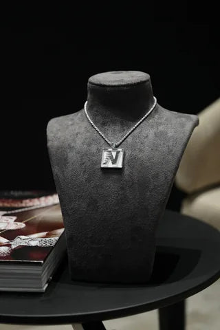 A custom tag pendant, styled in store
