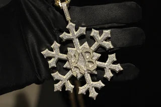 Snowflake pendant, held